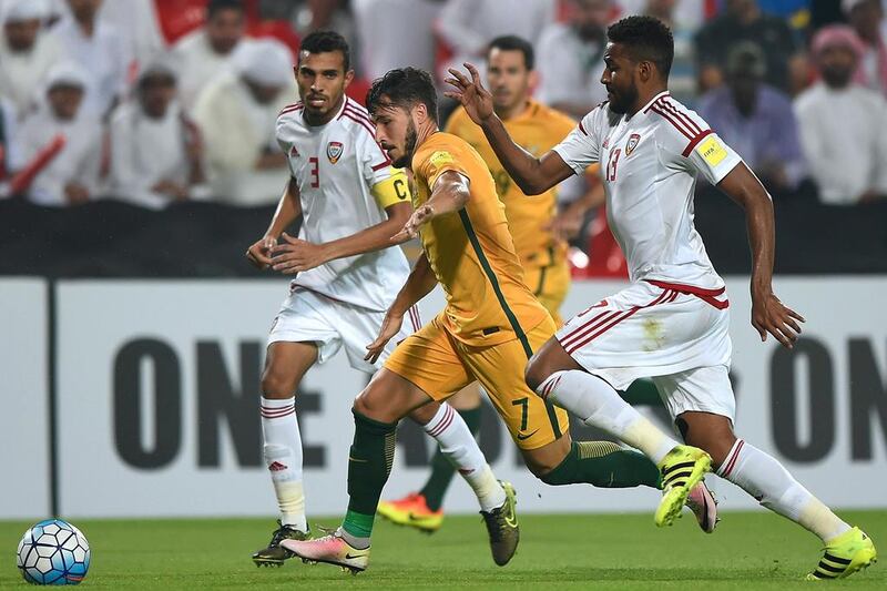 The UAE’s Khamis Ismail and Australia’s Mathew Leckie in action. Tom Dulat / Getty Images