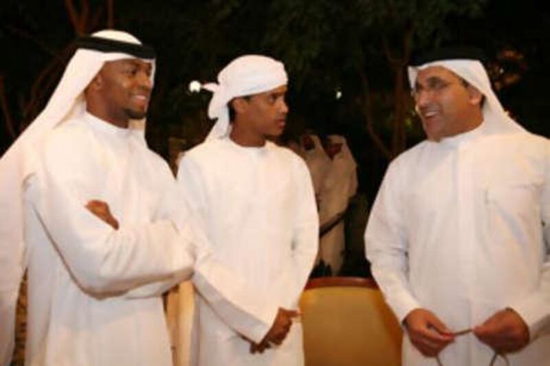 Ismail Rabee and Mohammed al Shehi chat with the UAE team manager Abdullah Hassan.