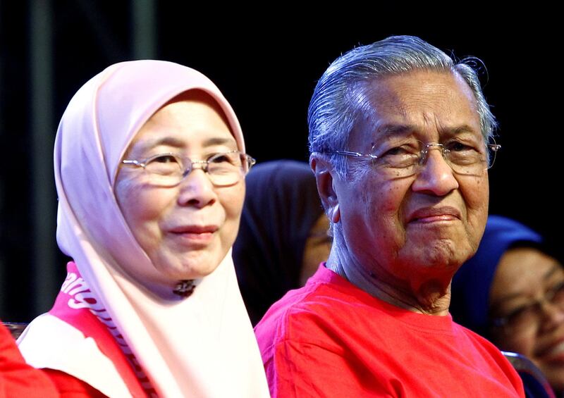 FILE PHOTO Former Malaysian prime minister Mahathir Mohamad and opposition leader Wan Azizah listen during an anti-kleptocracy rally in Petaling Jaya, near Kuala Lumpur, Malaysia October 14, 2017. REUTERS/Lai Seng Sin/Files