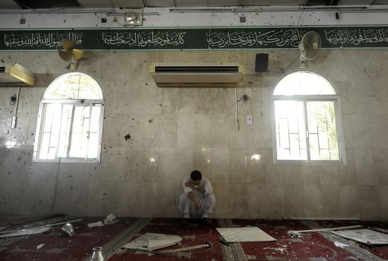 A Saudi man reacts following a blast inside a mosque. AFP Photo