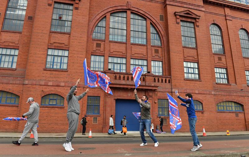 Rangers fans gather outside the Ibrox Stadium in Glasgow.