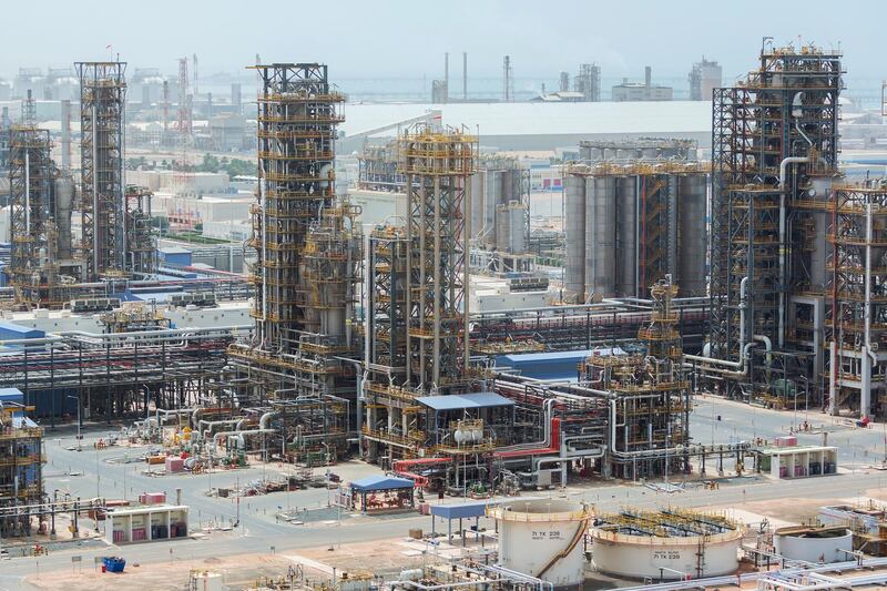 Cracking towers stand at the Ruwais refinery and petrochemical complex, operated by Abu Dhabi National Oil Co. (ADNOC), in Al Ruwais, United Arab Emirates, on Monday, May 14, 2018. Adnoc is seeking to create world’s largest integrated refinery and petrochemical complex at Ruwais. Photographer: Christophe Viseux/Bloomberg
