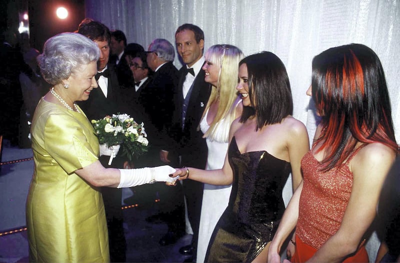 LONDON, UNITED KINGDOM - DECEMBER 01:  The Queen At The Royal Command Performance At The Victoria Palace Theatre On 1st December 1997 Shaking Hands With Pop Star Victoria Beckham (posh Spice) Of The Pop Band The Spice Girls.  (Photo by Tim Graham Picture Library/Getty Images)