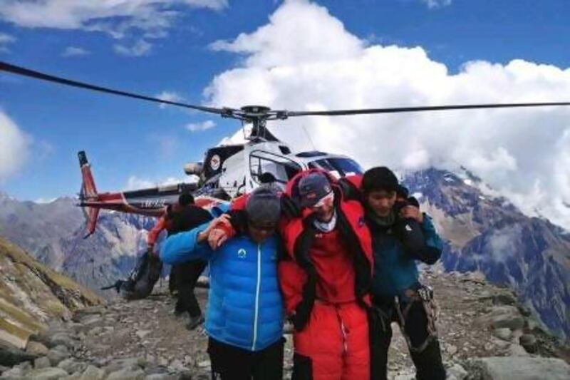 An unidentified tourist is rescued by a helicopter after an avalanche on Mount Manaslu in Gorkha village, Kathmandu.