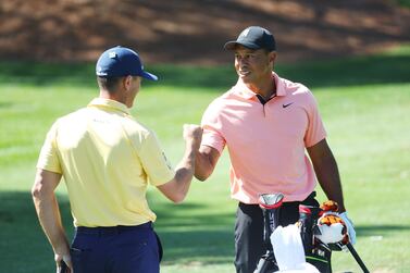 AUGUSTA, GEORGIA - APRIL 03: Tiger Woods of the United States talks to Billy Horschel of the United States in the practice area prior to the Masters at Augusta National Golf Club on April 03, 2022 in Augusta, Georgia.    Andrew Redington / Getty Images / AFP
