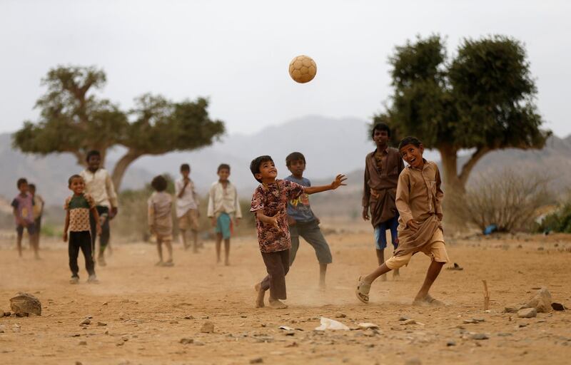 Boys play football in an camp for internally displaced people near Abs of the northwestern province of Hajja, Yemen. Reuters