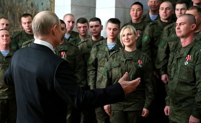 President Vladimir Putin addresses Russian troops at an awards ceremony in Rostov. EPA