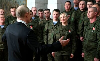 President Vladimir Putin addresses Russian troops at an awards ceremony in Rostov. EPA