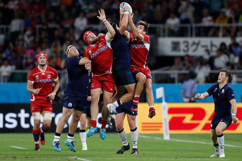 Players fight for the ball during the Japan 2019 Rugby World Cup Pool A match between Scotland and Russia at the Shizuoka Stadium Ecopa in Shizuoka. AFP