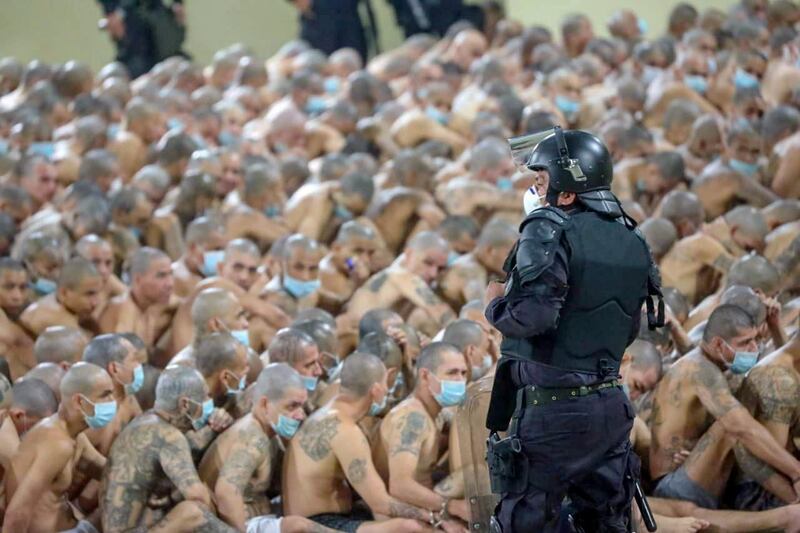 Gang members are secured during a police operation at Izalco jail during a 24-hour lockdown ordered by El Salvador's President Nayib Bukele in Izalco, El Salvador. Reuters