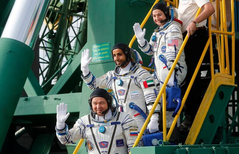 United Arab Emirates astronaut Hazza Al Mansouri, centre, Russian cosmonaut Oleg Skripochka, bottom, and U.S. astronaut Jessica Meir, top, members of the main crew to the International Space Station (ISS), board the Soyuz MS-15 spacecraft for the launch at the Russian leased Baikonur cosmodrome, Kazakhstan, Wednesday, Sept. 25, 2019. (Maxim Shipenkov/Pool Photo via AP)