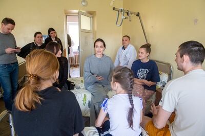 Jolie spoke to victims at the Kramatorsk railway station following missile strikes in April. EPA