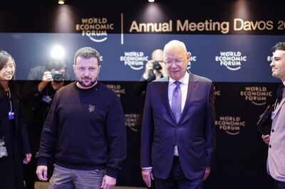 Ukrainian President Volodymyr Zelenskyy with WEF founder Prof Klaus Schwab on Tuesday. On some levels, Davos is glamorous but there is also something egalitarian about it: Mr Zelenskyy had to line up just like everyone else to get past security. Bloomberg