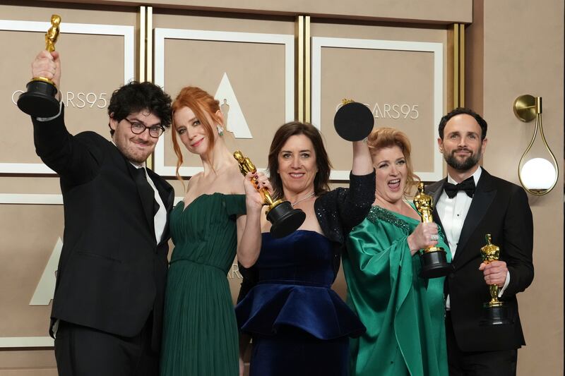 From left, Daniel Roher, Odessa Rae, Diane Becker, Melanie Miller and Shane Boris, winners of the award for Best Documentary Feature film for Navalny. AP