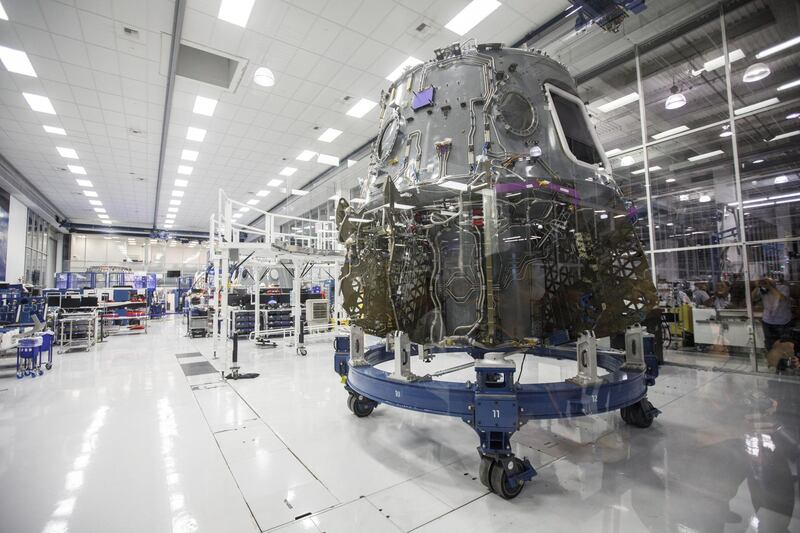 The Crew Dragon spacecraft is displayed in a clean room. Bloomberg