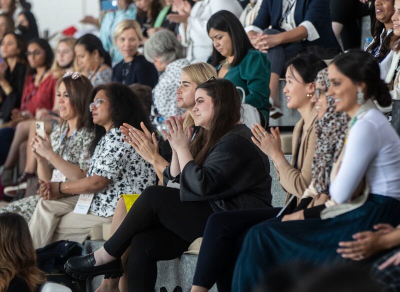 The audience listens to the speakers at the summit.