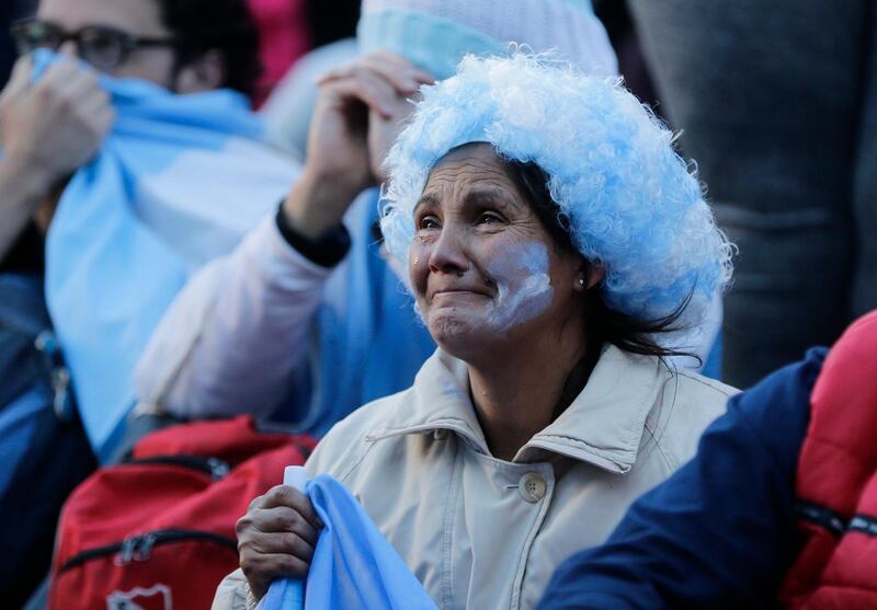Argentine fans react in disbelief at the end of a televised broadcast of the Croatia v Argentina World Cup match, in Buenos Aires. Jorge Saenz / AP Photo