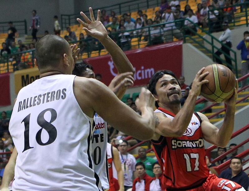 Manny Pacquiao shown driving to the basket during a Philippines Basketball Association game last year with his Kia Sorento team. Mike Young for The National / October 4, 2014