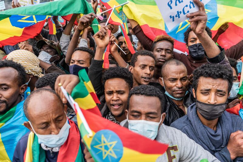 The Ethiopian national flag features prominently as demonstrators in Addis Ababa voice their dissatisfaction with the actions of the Tigray People's Liberation Front.