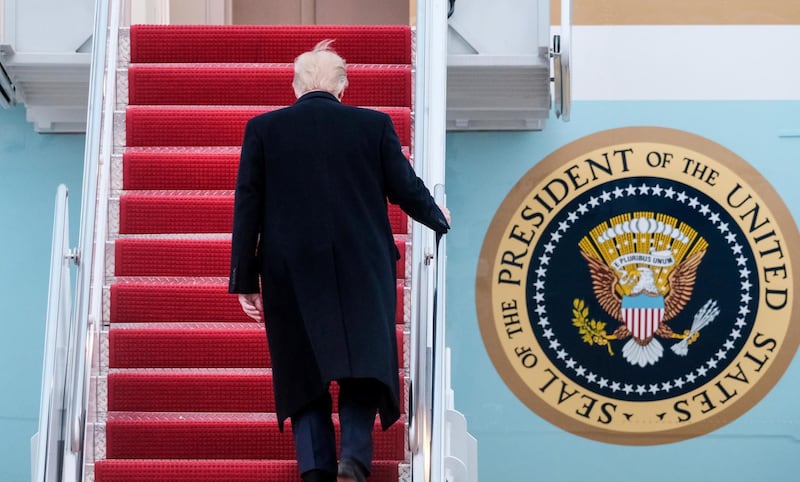 President Donald Trump boards Air Force One in Andrews Air Force Base, Md., en route to a campaign rally in Wildwood, N.J., Tuesday, Jan. 28, 2020.. (AP Photo/Michael McCoy)