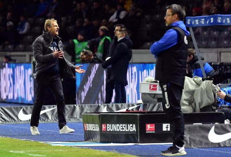 Hertha Berlin's former manager Jurgen Klinsmann, left, during a Bundesliga match against Schalke. EPA
