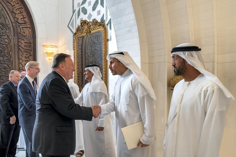 ABU DHABI, UNITED ARAB EMIRATES - September 19, 2019: HE Khaldoon Khalifa Al Mubarak, CEO and Managing Director Mubadala, Chairman of the Abu Dhabi Executive Affairs Authority and Abu Dhabi Executive Council Member (2nd R), greets Michael R Pompeo, Secretary of State of the United States of America (L), prior to a meeting the Sea Palace. Seen with HE Mohamed Mubarak Al Mazrouei, Undersecretary of the Crown Prince Court of Abu Dhabi (R). 

( Mohamed Al Hammadi / Ministry of Presidential Affairs )
---