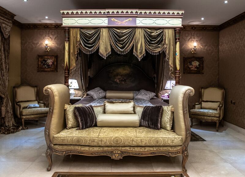 A hand-carved pillar bed in the master bedroom.