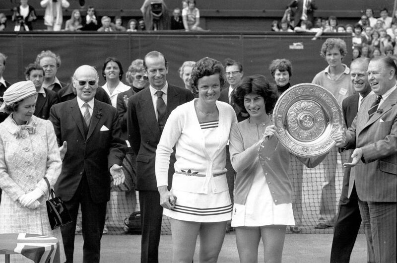 July 1977:  British tennis player Virginia Wade holding the trophy she won after defeating Holland's Betty Stove in the finals at Wimbledon. The trophy was presented by Queen Elizabeth II (left) during her Silver Jubilee Year.  (Photo by Central Press/Getty Images)