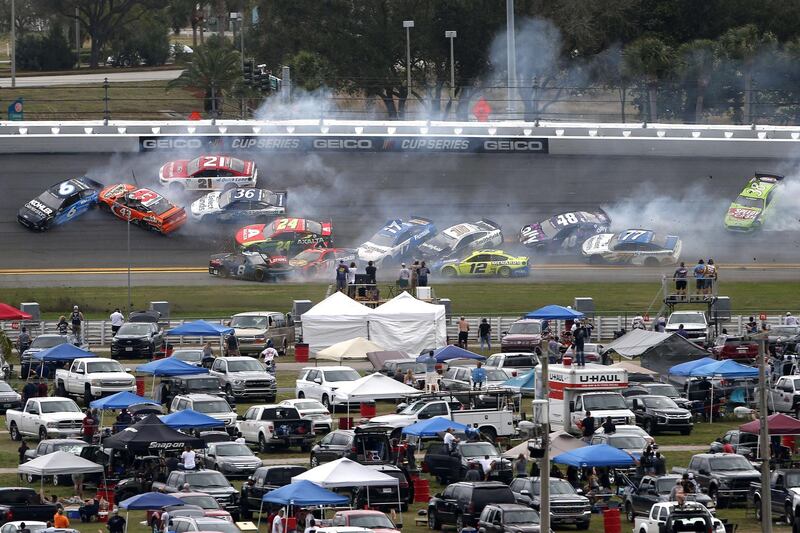 The first crash of the race after just 14 laps. AFP