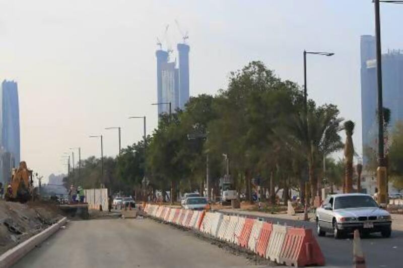 Road expansion works in progress on 32nd Street in Abu Dhabi. Infrastructure spending will boost the capital's economy. Ravindranath K / The National