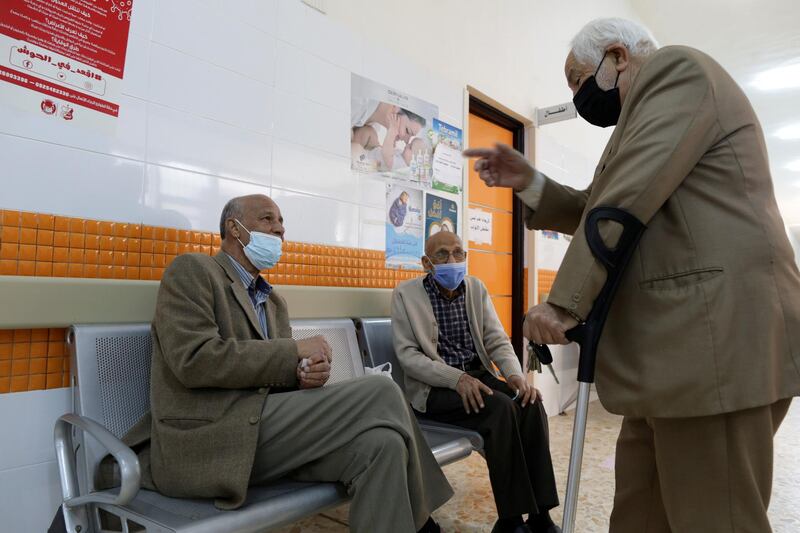 People wait to receive a dose of the AstraZeneca Covid-19 vaccine, in Benghazi, Libya. Reuters