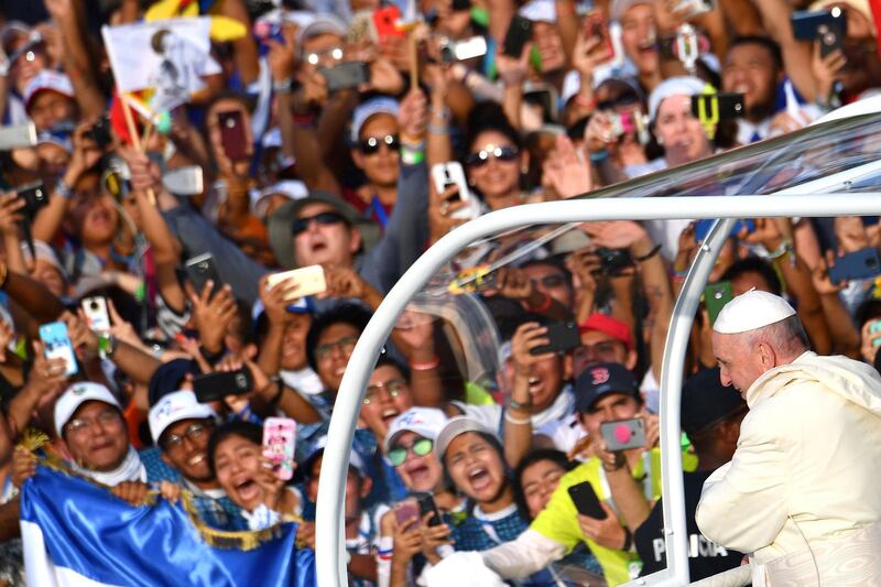 Pope Francis smiles at the faithful as he arrives for his welcome ceremony at Campo Santa Maria La Antigua in Panama City. AFP