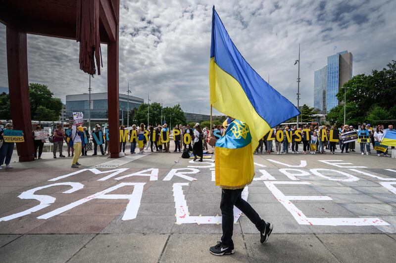 Protesters outside a special session of the UN Human Rights Council on the war in Ukraine, in Geneva. Inside, Ukrainians lambasted the 'sheer horror' and 'pure evil' being inflicted on their country by Russian forces. AFP