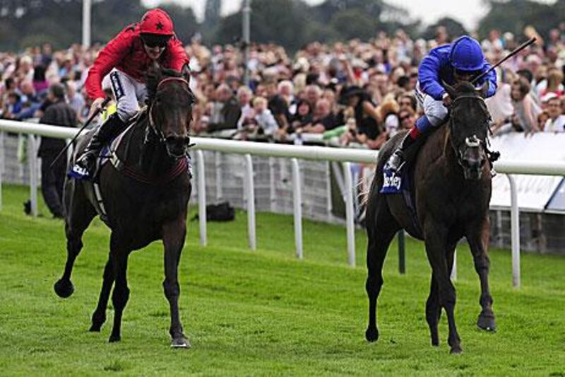 Frankie Dettori, right, on Blue Bunting, beats Vita Nova, ridden by Tom Queally, in the Darley Yorkshire Oaks. The Italian, who rides for Godolphin, has been told to adhere to the new whip law, while the decision on whether Vita Nova will race will be made today.