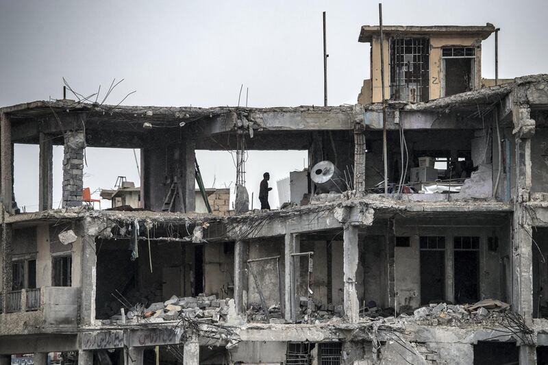 MOSUL, IRAQ - APRIL 11:  A man stands in the ruins of a building destroyed during fighting between Iraqi forces and Islamic State, on April 11, 2017 in Mosul, Iraq. Large swathes of Mosul have been severely damaged by six months of fighting to retake the city, Iraq's second largest, from Islamic State who have held it since 2014.  (Photo by Carl Court/Getty Images)