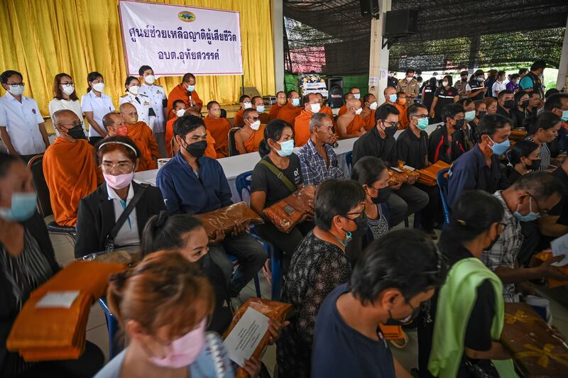 Buddhist monks sit before giving blessings to the families of the victims in Uthai Sawan subdistrict, Nong Bua Lamphu, Thailand. Getty Images