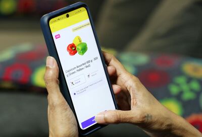 Verodiana Rodrigues, a financial planner and former Dubai schoolteacher, uses an app that offers big discounts on bulk orders. Chris Whiteoak / The National