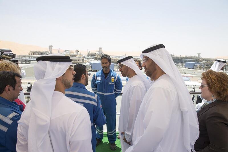 Sheikh Mohammed bin Zayed, centre, Crown Prince of Abu Dhabi and Deputy Supreme Commander of the UAE Armed Forces, speaks with an Al Hosn Gas employee. Also in the picture are US ambassador to the UAE Barbara Leaf, right, Sultan Al Jaber, chief exective of Adnoc, second right, and Sheikh Mansour bin Zayed, Deputy Prime Minister and Minister of Presidential Affairs, second left. Mohamed Al Hammadi / Crown Prince Court - Abu Dhabi