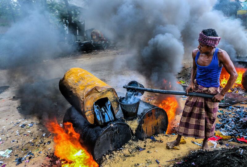 Honourable Mention, Climate, Ziaul Huque, Bangladesh. A road construction worker in Bangladesh.