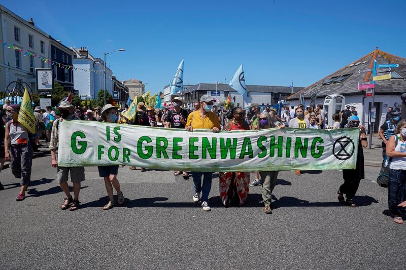 Climate demonstrators march through the centre of Falmouth, Cornwall. Getty