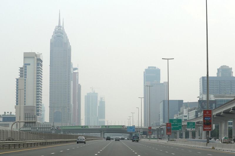DUBAI, UNITED ARAB EMIRATES , August 10 – 2020 :- Traffic during the hazy weather on Sheikh Zayed road in Dubai. (Pawan Singh / The National) For News/Online