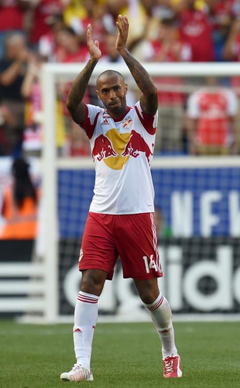 Thierry Henry walks off the pitch following a friendly on July 26 this year against Arsenal with New York Red Bulls at Red Bull Arena in New Jersey. Don Emmert / AFP
