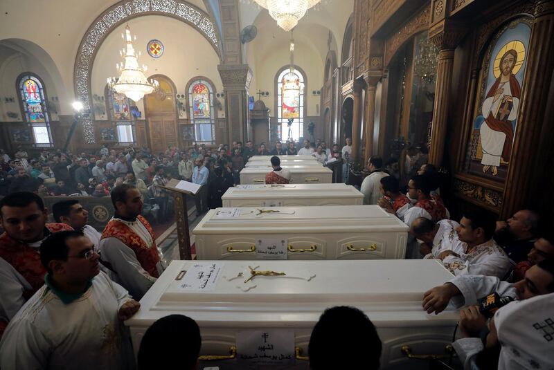 Mourners gather for the funeral of Coptic Christians who were killed in the attack at the Prince Tadros Church. Reuters
