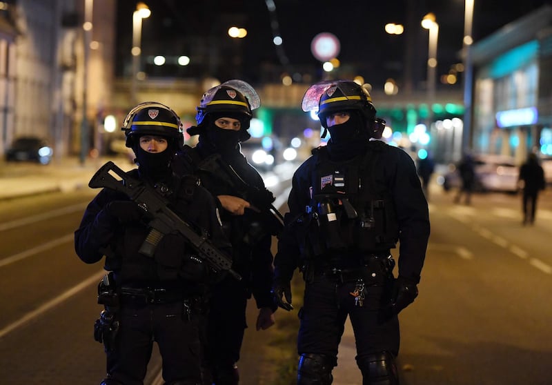 French police officers block the road near the site where Cherif Chekatt was shot. AFP