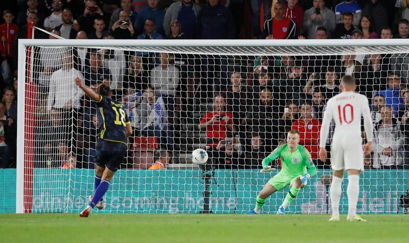 Kosovo's Vedat Muriqi scores their third goal from the penalty spot. Reuters