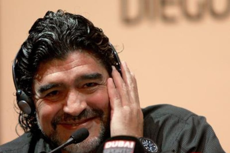 Argentine football legend Diego Maradona speaks during a press conference in Dubai, on June 04, 2011 as he was introduced as the new coach of the al-Wasel football club. Maradona will train al-Wasel for two years.       AFP PHOTO/MARWAN NAAMANI

