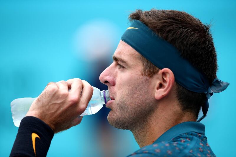 LONDON, ENGLAND - JUNE 19: Juan Martin del Potro of Argentina takes a drink during his First Round Singles Match against Denis Shapovalov of Canada during day Three of the Fever-Tree Championships at Queens Club on June 19, 2019 in London, United Kingdom. (Photo by Clive Brunskill/Getty Images)