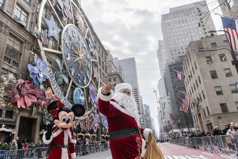 A man dressed as Santa Claus walks on 5th Avenue on Christmas Eve in New York, US. Reuters