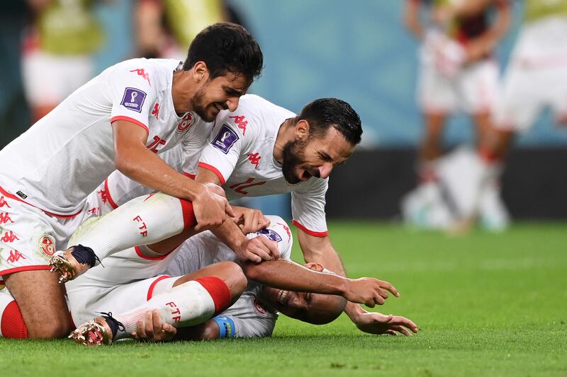 Wahbi Khazri of Tunisia celebrates with teammates after scoring their first goal. Getty 