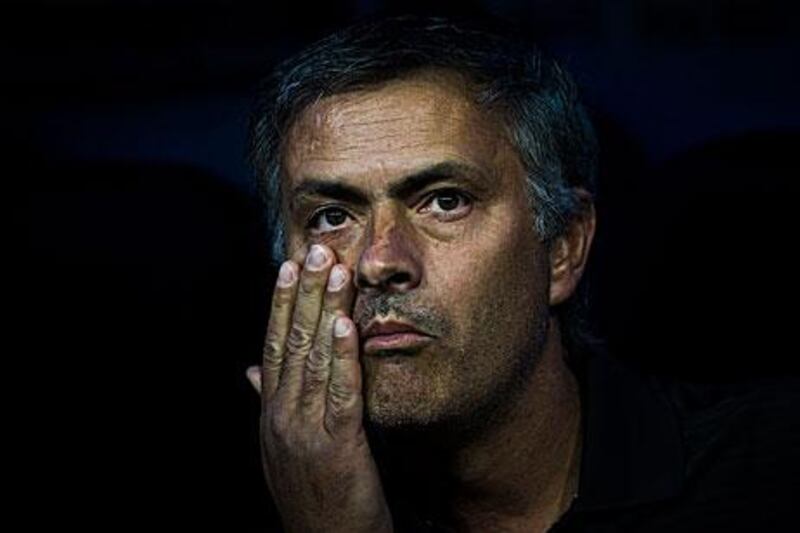 Jose Mourinho, the Real Madrid coach, poked Tito Vilanova in the eye during his side's defeat to Barcelona on Wednesday.